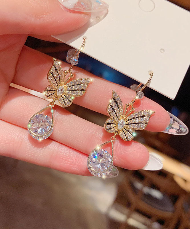 Elegantes pendientes de mariposa con cristales de circonita y aleación de oro.