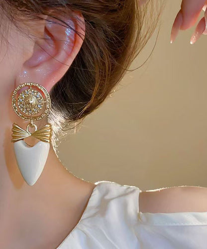 Elegante Ohrringe aus Gold-Kupfer-Legierung mit Zirkonia in Schleifenform