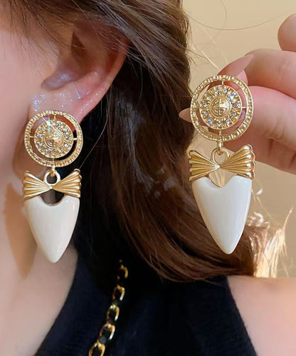 Elegante Ohrringe aus Gold-Kupfer-Legierung mit Zirkonia in Schleifenform