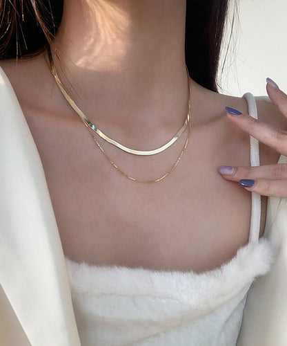 Elegante collar bicapa de plata de ley dorada