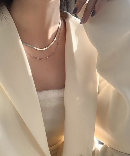 Elegante collar bicapa de plata de ley dorada