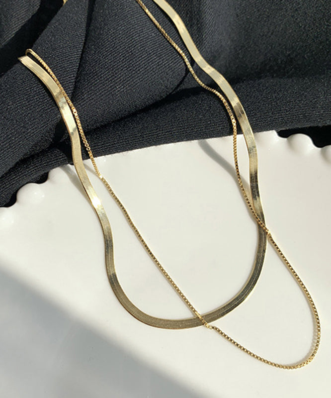 Elegante collar bicapa de plata de ley dorada