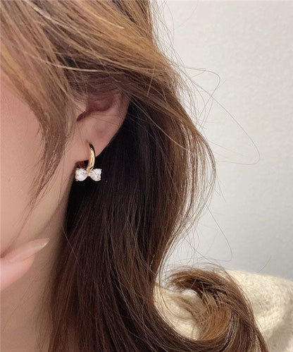 Elegantes pendientes de aro con lazo de cristal y plata de ley dorada