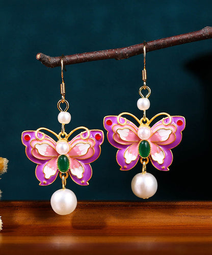 Elegantes pendientes colgantes de mariposa con perlas acrílicas doradas de cobre morado