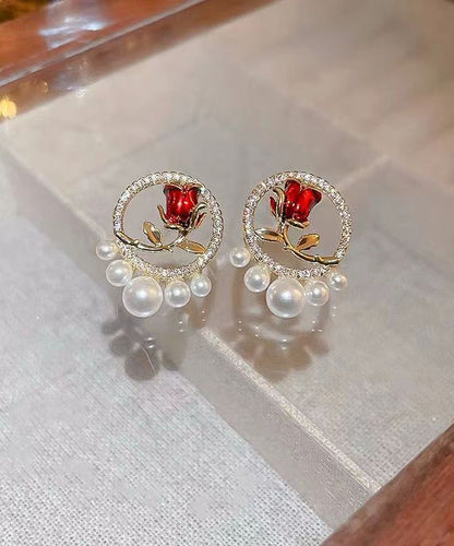 Elegantes pendientes de rosa con perla y circonita de cobre rojo