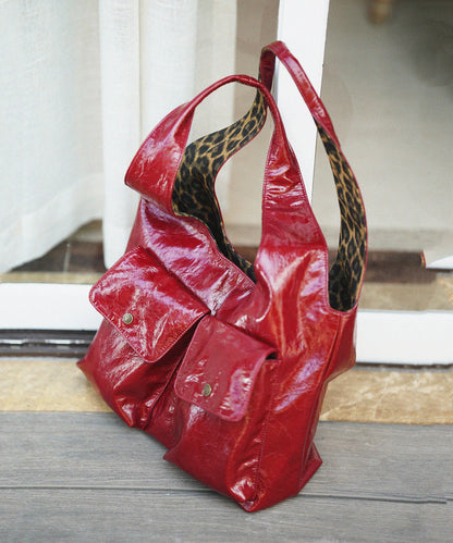 Elegante rote Schultertasche mit Leopardenmuster und Taschen aus Kunstleder