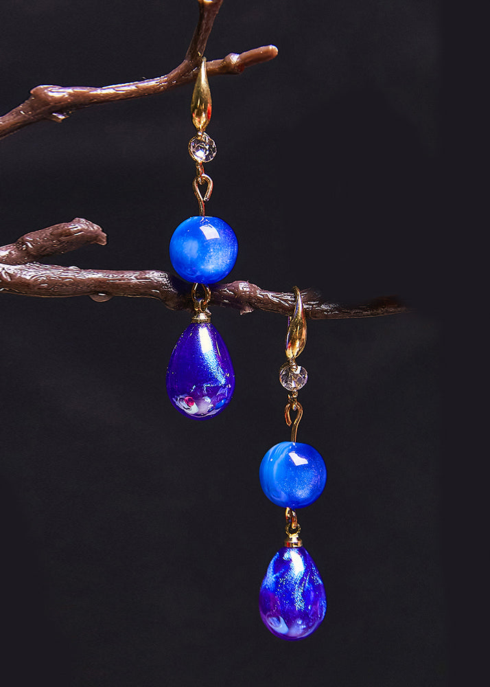 Ohrringe aus Acryl mit Pfauenblau und Wassertropfen im Ethno-Stil