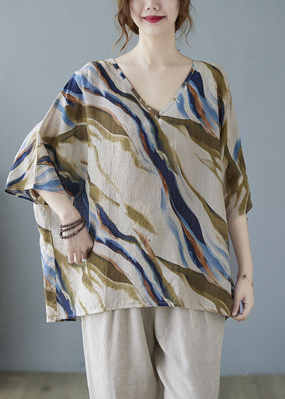 Modisches, blaues, gestreiftes Oberteil mit Fledermausflügelärmeln und V-Ausschnitt und asymmetrischem Design