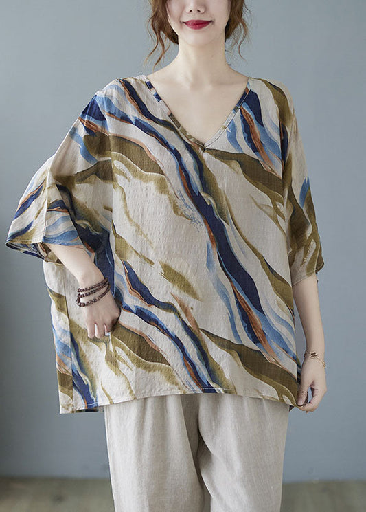 Modisches, blaues, gestreiftes Oberteil mit Fledermausflügelärmeln und V-Ausschnitt und asymmetrischem Design