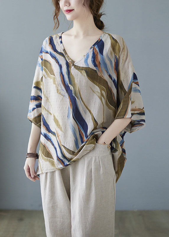 Modisches, blaues, gestreiftes Oberteil mit Fledermausflügelärmeln und V-Ausschnitt und asymmetrischem Design