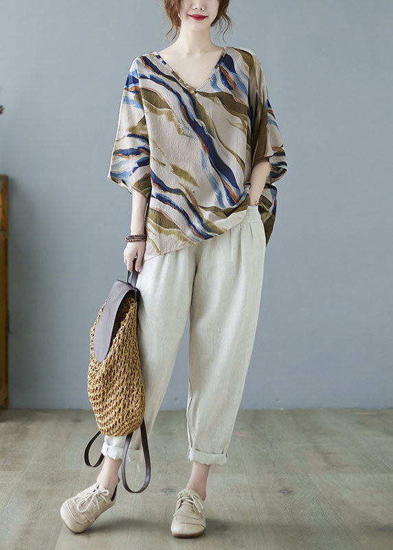 Modisches, blaues, gestreiftes Oberteil mit Fledermausflügelärmeln und V-Ausschnitt und asymmetrischem Design