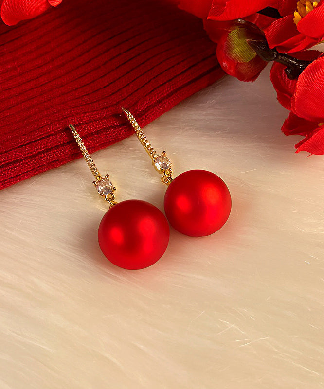 Pendientes colgantes de cobre y circonitas con perlas y color champán