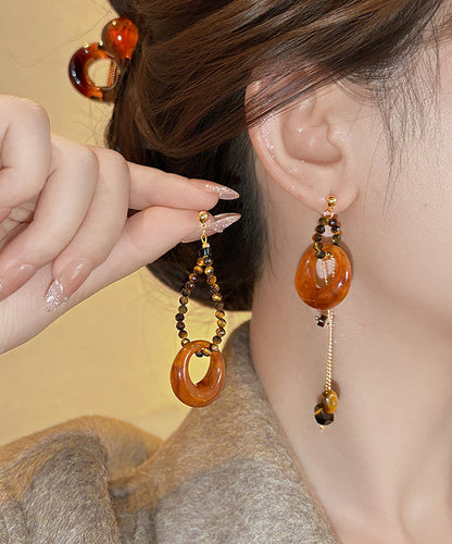 Modische, kaffeefarbene Ohrhänger aus Sterlingsilber mit Goldauflage und asymmetrischem Perlen-Quasten-Design