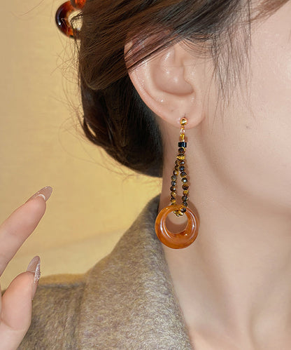 Modische, kaffeefarbene Ohrhänger aus Sterlingsilber mit Goldauflage und asymmetrischem Perlen-Quasten-Design