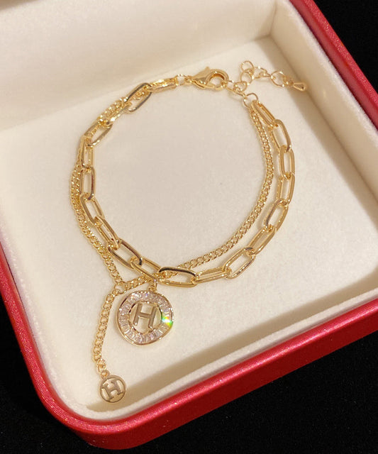 Modisches Charm-Armband mit Quaste und Kristallen in Goldlegierung