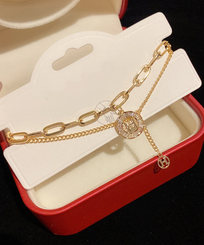 Modisches Charm-Armband mit Quaste und Kristallen in Goldlegierung