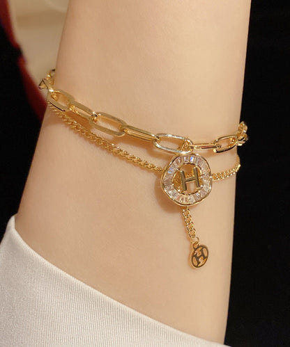 Modisches Charm-Armband mit Quaste und Kristallen in Goldlegierung