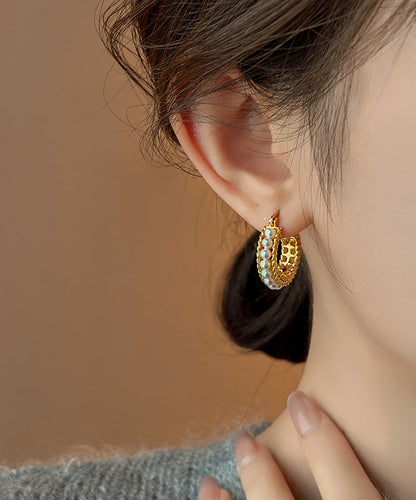 Pendientes de aro con perlas doradas y cobre dorado