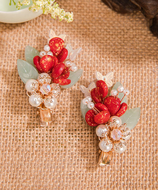 Par de horquillas para el pelo con diseño de hojas esmaltadas de colores perlados y aleación multicolor.