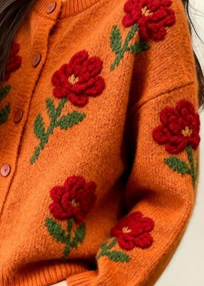 Cárdigan holgado de punto con estampado floral y cuello redondo de color naranja a la moda para primavera.