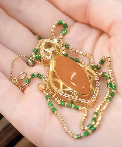 Collar con colgante de bambú y ágata de circonita dorada en plata de ley naranja