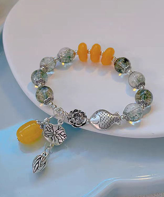 Modisches Bettelarmband aus Sterlingsilber mit Kristallen und kleinen Fischen, die mit einer Lotusblüte spielen