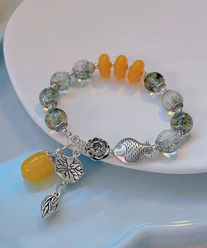 Modisches Bettelarmband aus Sterlingsilber mit Kristallen und kleinen Fischen, die mit einer Lotusblüte spielen