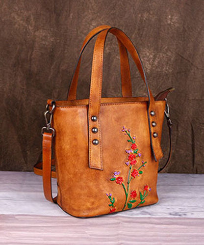 Modische Umhängetasche aus Kalbsleder in Gelb mit Prägung