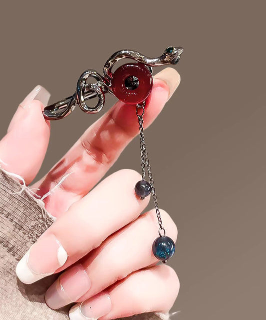 Horquilla con borla y hebilla serpentina de aleación negra fina