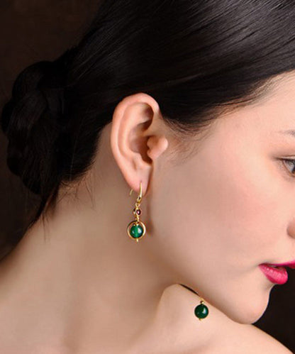 Pendientes asimétricos de libélula con ágata y granate en oro fino de 14 quilates