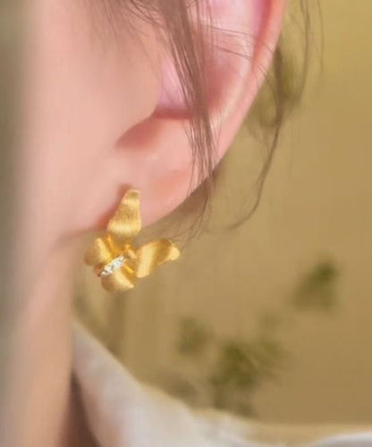 Feine goldene Ohrstecker mit Zirkonia-Motiv im Stil des antiken Dharma-Schmetterlingsmotivs