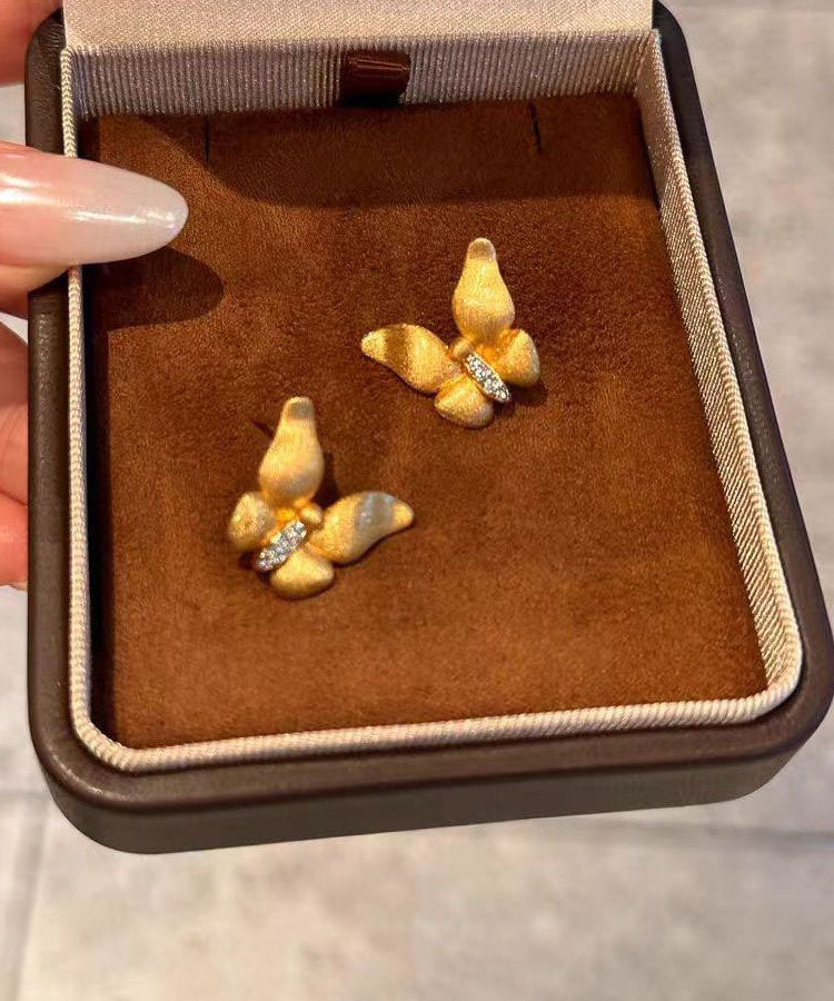 Feine goldene Ohrstecker mit Zirkonia-Motiv im Stil des antiken Dharma-Schmetterlingsmotivs