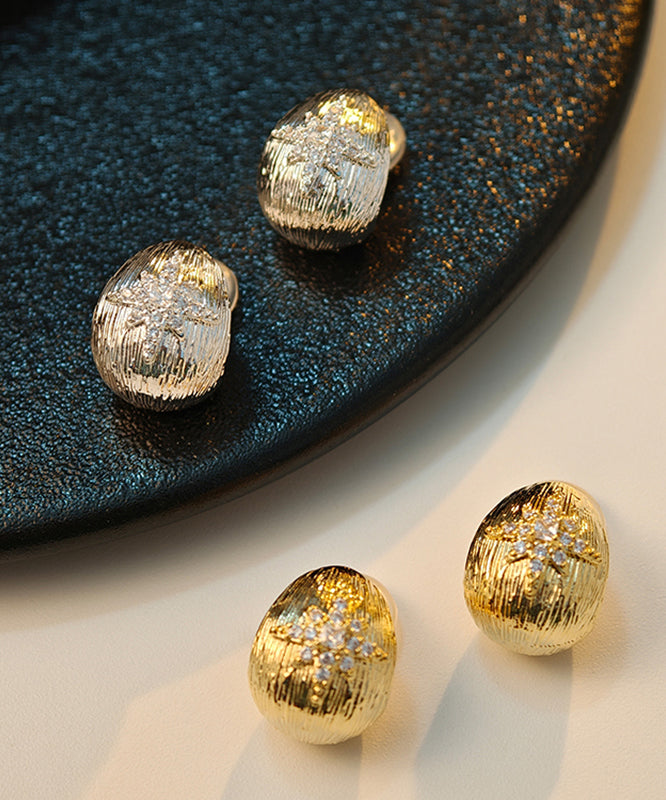 Pendientes de botón con hexagrama de circonitas y cobre dorado fino