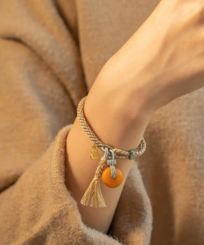 Feines Khaki-Handstrickarmband mit Bienenwachs-Kürbisquaste