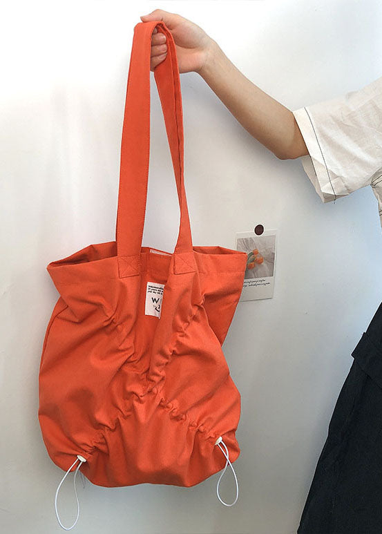 Feine orangefarbene Handtasche aus zerknitterter Baumwolle mit Kordelzug