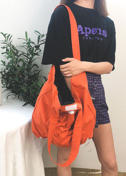 Feine orangefarbene Handtasche aus zerknitterter Baumwolle mit Kordelzug