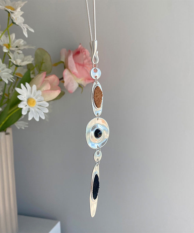 Halskette mit Anhänger in Tropfenform aus feiner Seide, Edelstahl und Leder