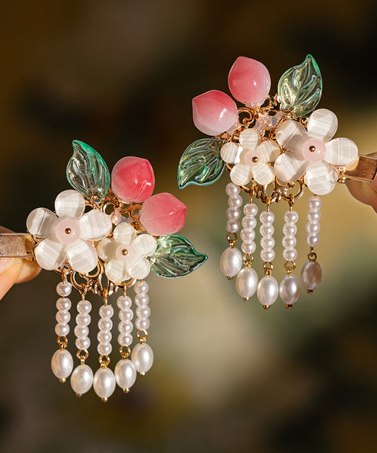 Par de horquillas con borlas de resina color melocotón y perla de aleación blanca fina