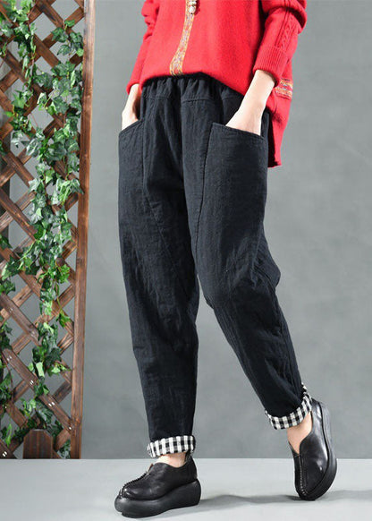 Taillierte schwarze Hosen mit Taschen und feiner Baumwollfüllung für den Winter