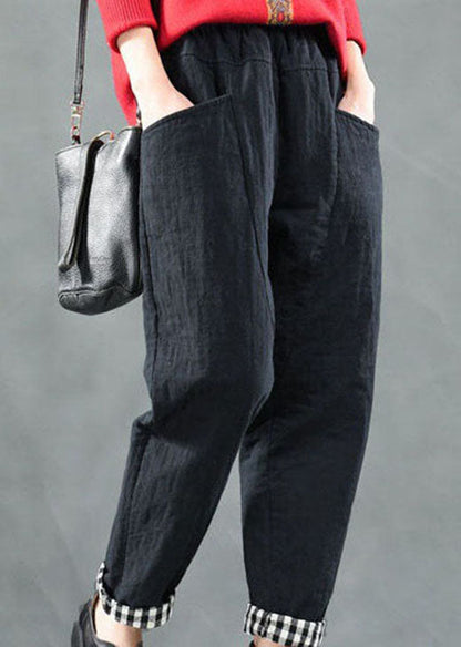 Taillierte schwarze Hosen mit Taschen und feiner Baumwollfüllung für den Winter