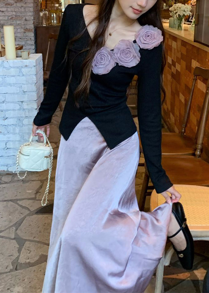 Zweiteiliges Set aus geblümtem schwarzem Stricktop mit V-Ausschnitt und lila Rock für den Frühling