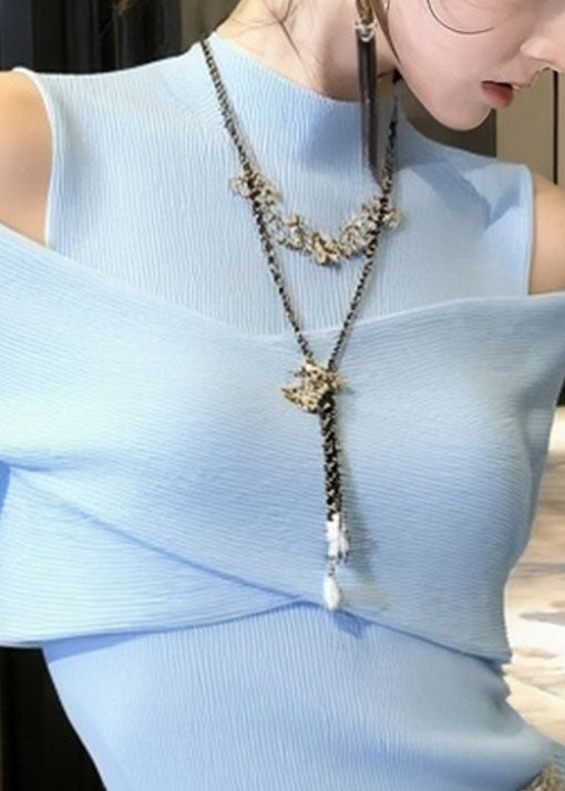 Suéter de punto con hombros descubiertos y patchwork en azul francés para primavera