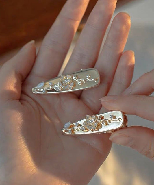 Par de horquillas francesas de aleación dorada con diseño floral de perlas