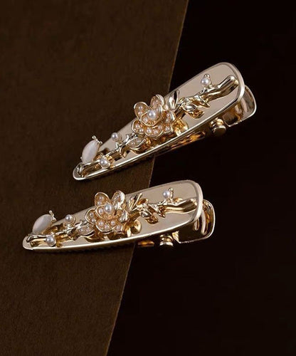 Par de horquillas francesas de aleación dorada con diseño floral de perlas