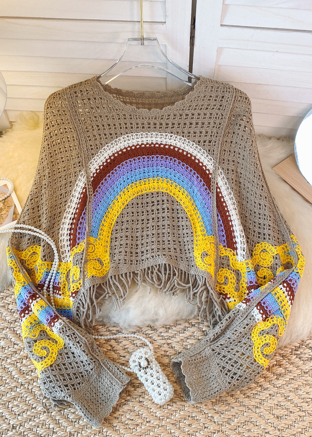 Suéter de punto con estampado de arcoíris ahuecado y borlas azules y blancas francesas de otoño