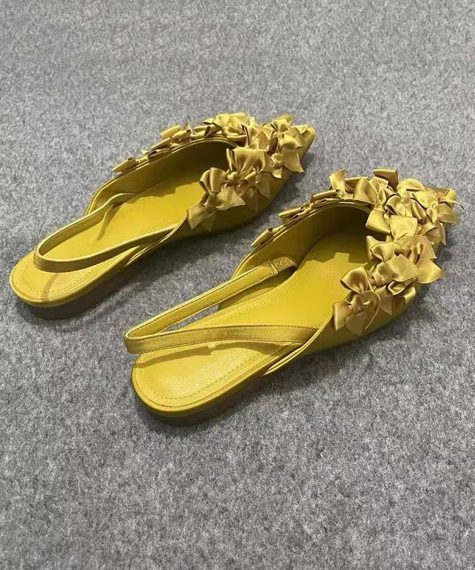 Französische flache Sandalen mit gelber Schleife und spitzer Zehenpartie