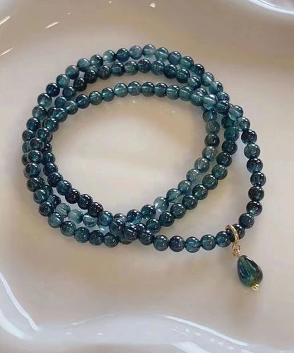 Pulsera con borlas y gemas doradas de plata de ley azul hecha a mano
