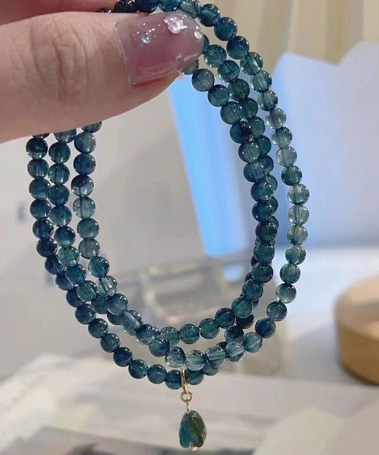 Pulsera con borlas y gemas doradas de plata de ley azul hecha a mano