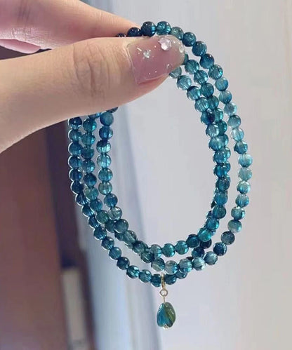 Pulsera con borlas y gemas doradas de plata de ley azul hecha a mano