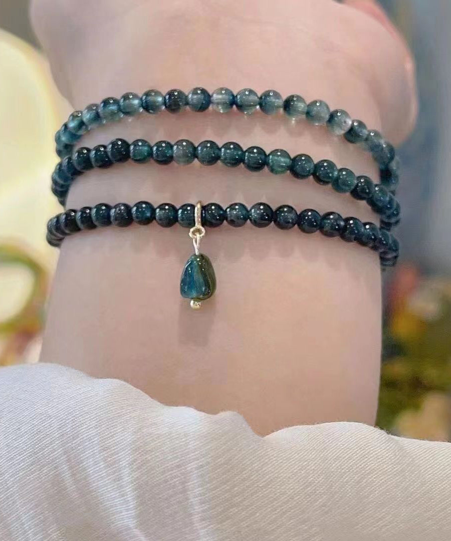 Pulsera con borlas y gemas doradas de plata de ley azul hecha a mano